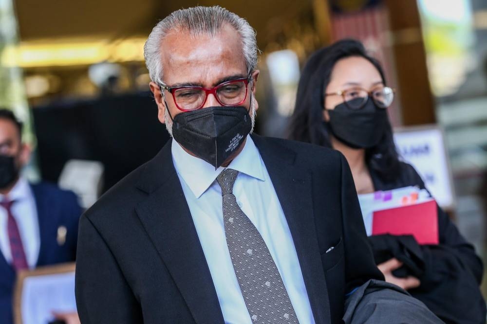 Lawyer Tan Sri Muhammad Shafee Abdullah leaves the Kuala Lumpur High Court April 6, 2022. — Picture by Devan Manuel