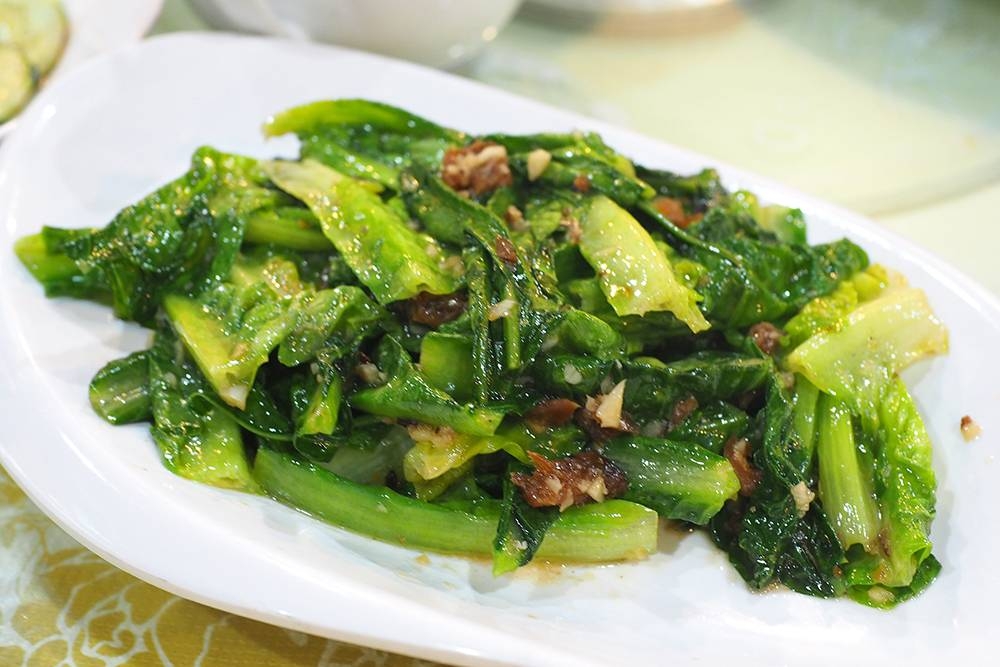 Relish the crunchy texture of the HK lettuce stir fried with dace fish