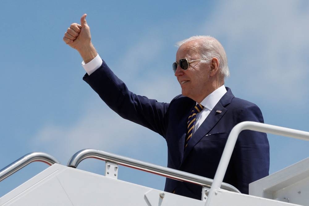 US President Joe Biden boards Air Force One to depart for his first trip to Asia as sitting president from Joint Base Andrews, Maryland May 19, 2022. — Reuters pic