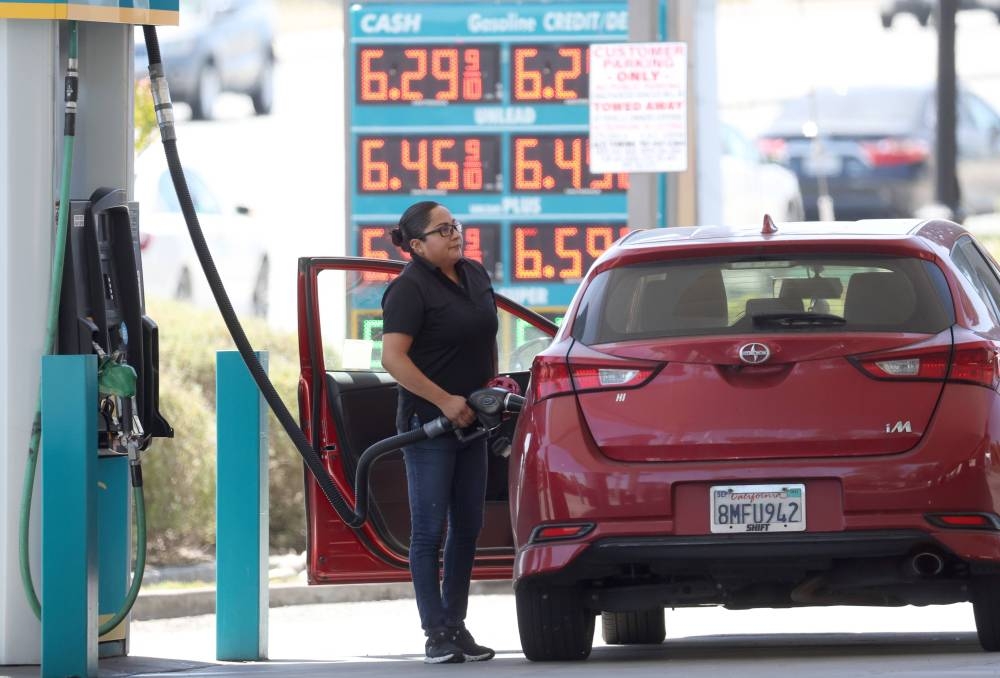 A customer pumps gas into their car at a gas station on May 18, 2022 in Petaluma, California. — AFP pic