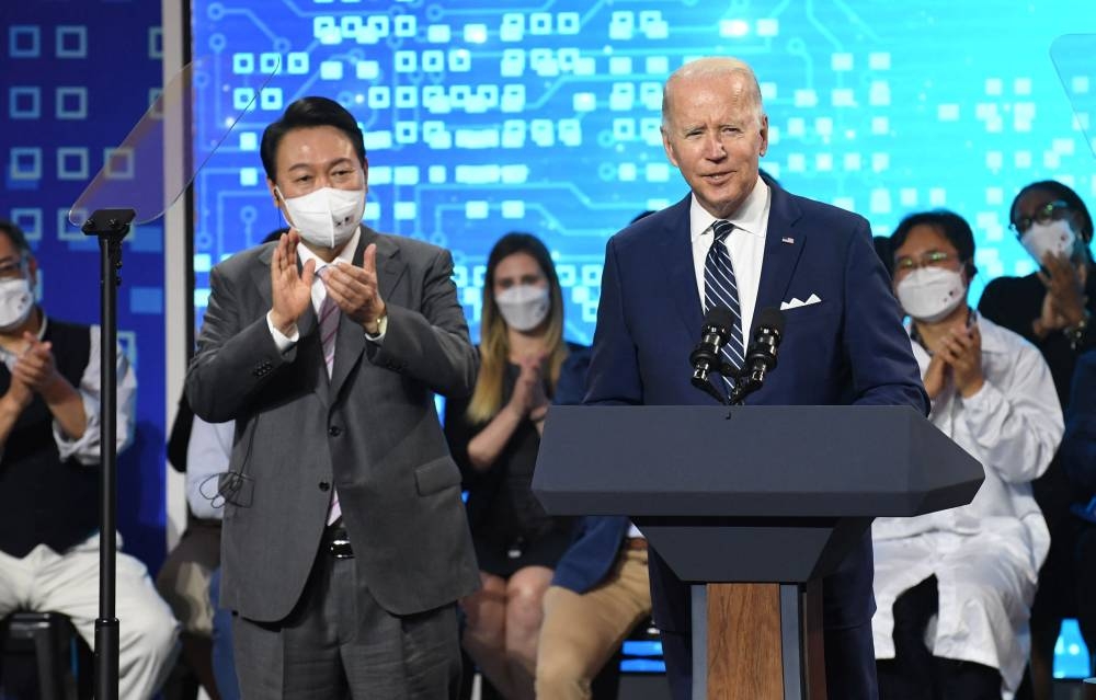 US President Joe Biden (right) speaks with South Kroean President Yoon Suk-youl (L) during a press conference after visiting at the Samsung Electronic Pyeongtaek Campus in Pyeongtaek on May 20, 2022. — AFP pic