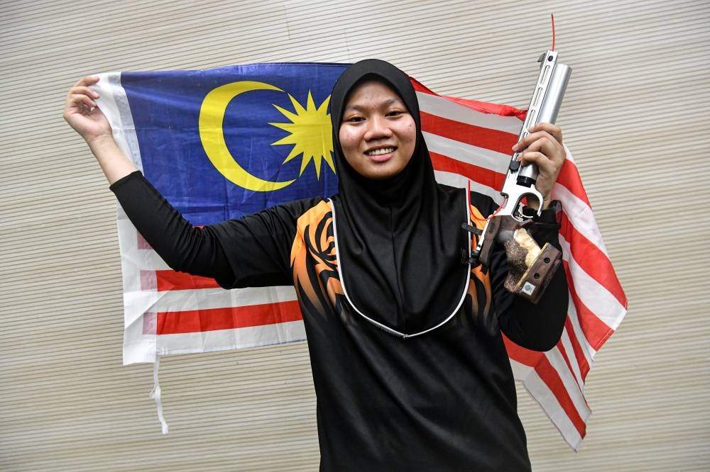 National shooter Nurul Syasya Nadiah Mohd Arifin created a surprise by winning the women’s 10 metre air pistol in her debut appearance at the SEA Games, May 20, 2022. — Bernama pic 