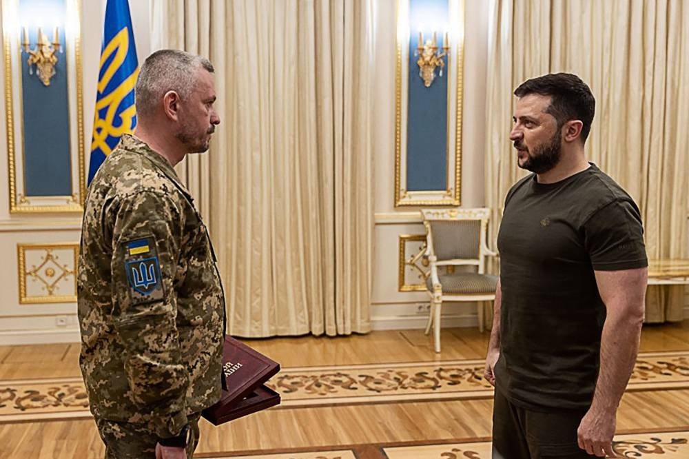This handout picture taken and released by Ukrainian Presidential press-service in Kyiv on May 18, 2022, shows the President Volodymyr Zelensky (right) presenting the Golden Star orders to a Ukrainian serviceman awarded with the title of ‘Hero of Ukraine’. ― AFP pic
