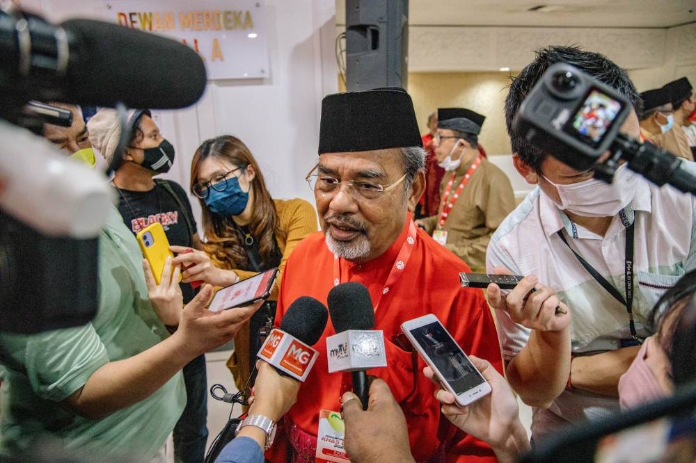 File picture shows Umno supreme council member Datuk Seri Tajuddin Abdul Rahman speaking to reporters at the Umno extraordinary general meeting (EGM) at the World Trade Centre in Kuala Lumpur May 15, 2022. — Picture by Firdaus Latif