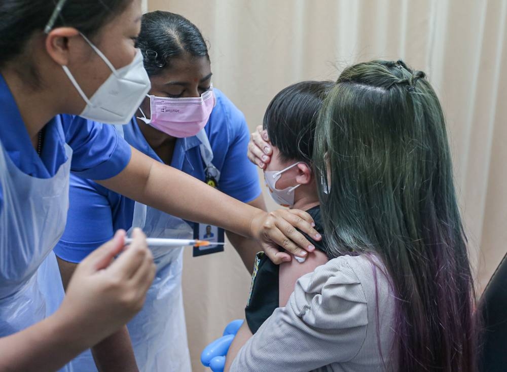 Children getting their Covid-19 vaccination at the Perak Community Specialist Hospital in Ipoh on Friday, February 25 under the National Covid-19 Immunization Programme for Children. — Picture by Farhan Najib