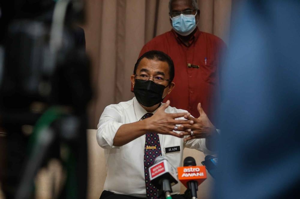 Deputy Minister of Health Datuk Dr Noor Azmi Ghazali speaks to the press during his visit at Vaccination Administration Centre in Milennium Hall, Bertam on July 9, 2021. — Picture by Sayuti Zainudin