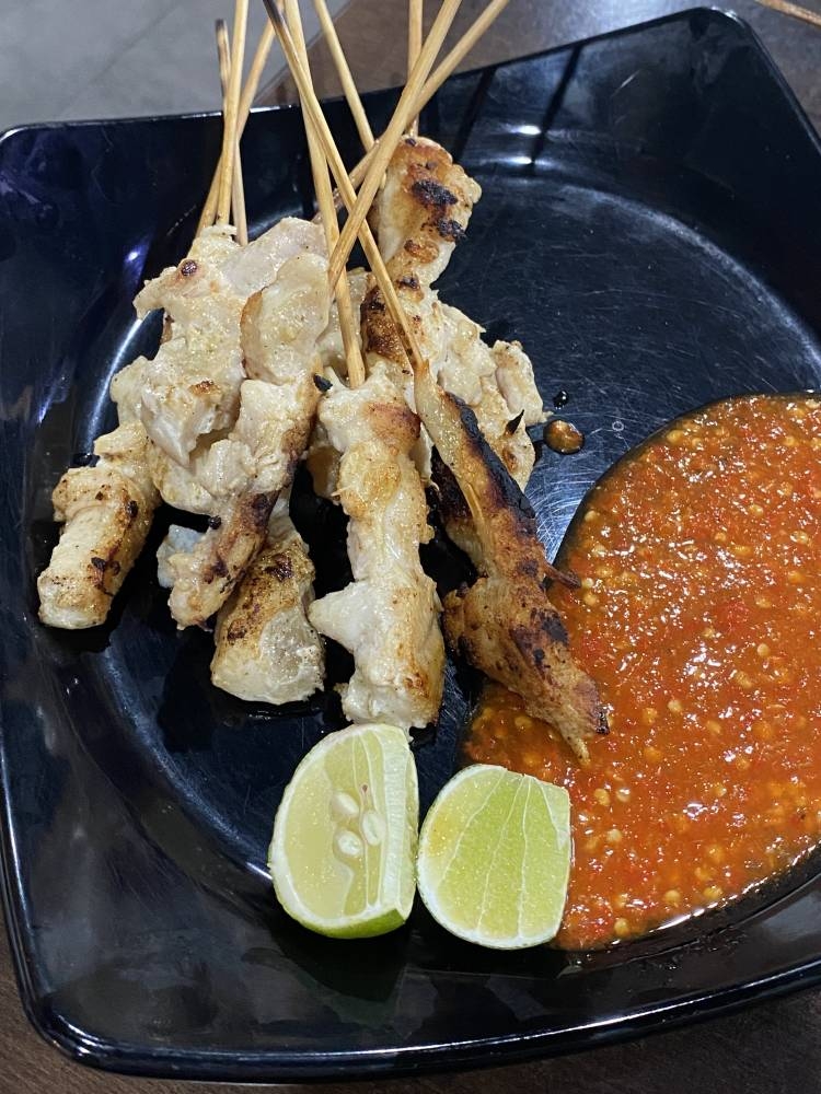 Sample the unusual Indonesian street food known as 'sate taichan' where chicken is grilled and served with chilli sauce and lime.