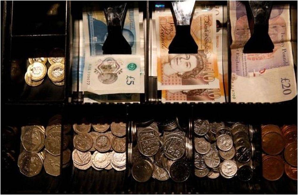 Pound Sterling notes and change are seen inside a cash register in a coffee shop in Manchester September 21, 2018. —  Reuters pic