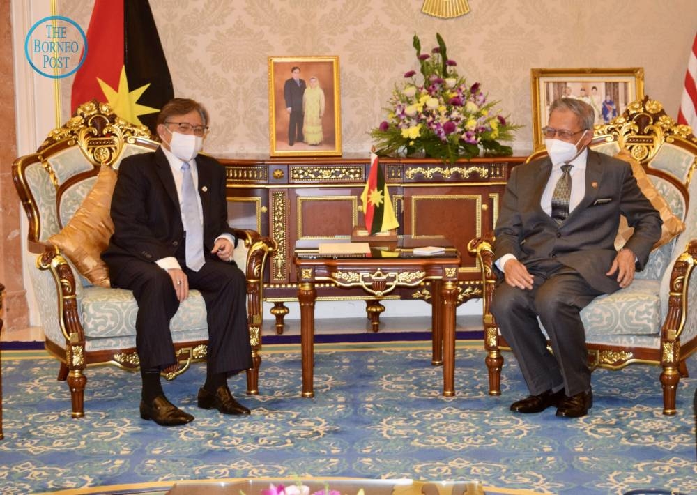 Datuk Seri Mustapa Mohamed (right) and Tan Sri Abang Johari Openg during a courtesy call at the State Legislative Assembly in Kuching, May 25, 2022. — Borneo Post Online pic 