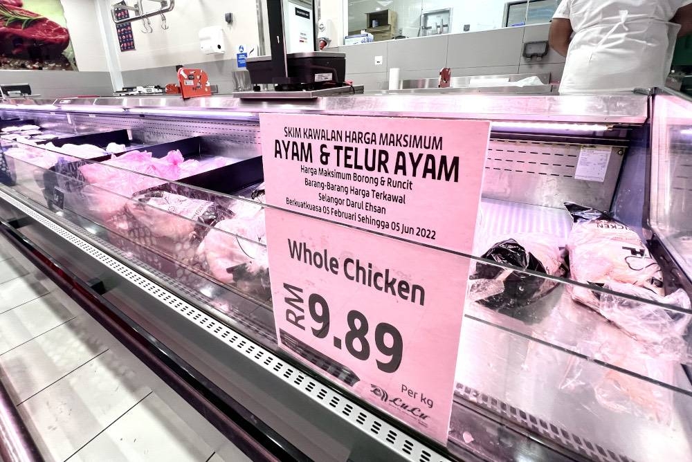 A price listing for chicken and eggs is seen in a supermarket in Shah Alam, May 22, 2022. — Picture by Miera Zulyana