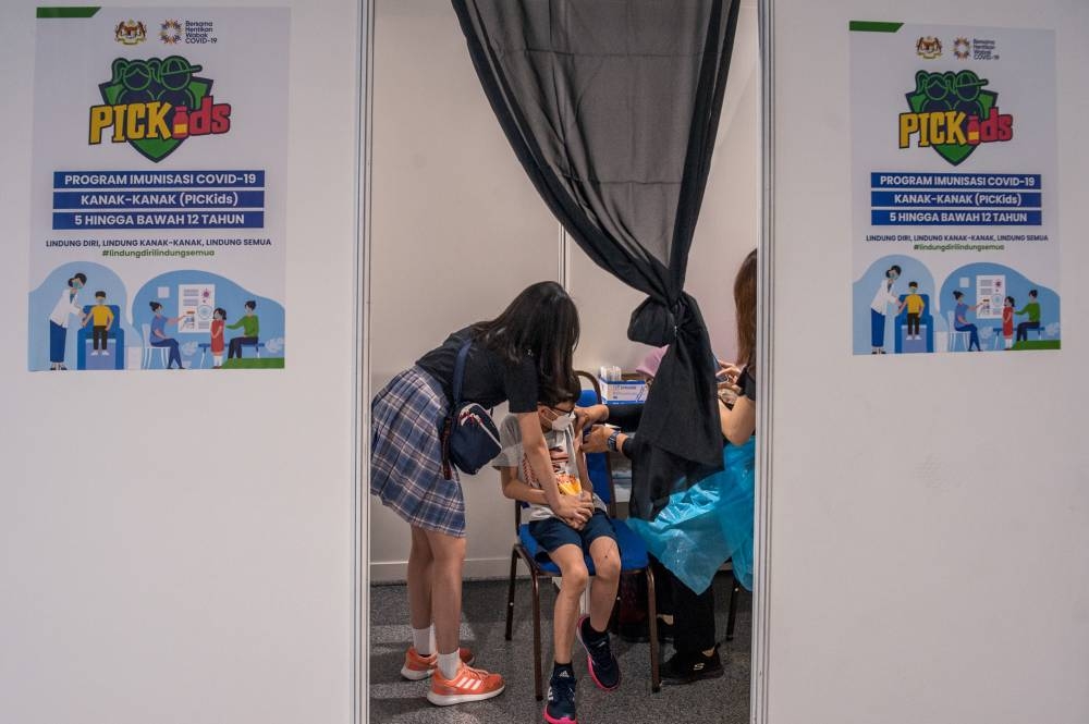 Children aged between five and 12-years-old receive their Covid-19 vaccine at the Axiata Arena in Bukit Jalil February 3, 2022. — Picture by Shafwan Zaidon