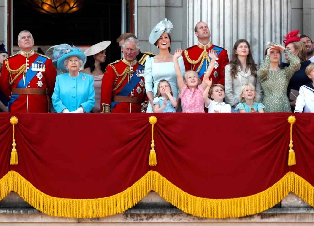 Britain's Queen Elizabeth along with other members of the British royal family, look up at the RAF flypast from the balcony of Buckingham Palace as part of Trooping the Colour parade in central London June 9, 2018. — Reuters pic