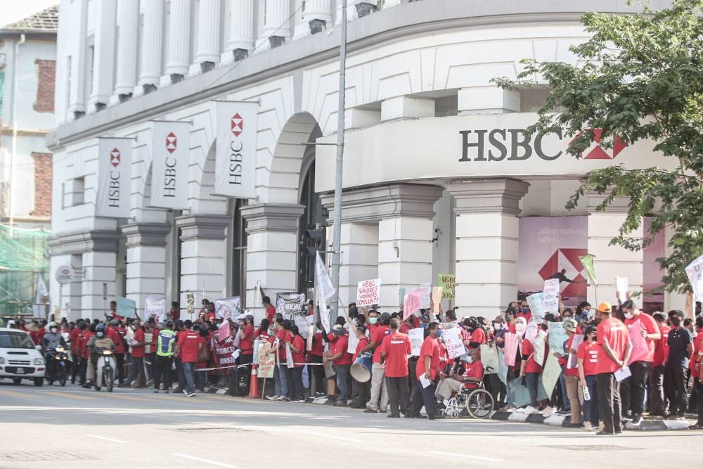 National Union of Bank Employees (Nube) members staged a picket in front of HSCB office in Ipoh May 26, 2022. — Picture by Farhan Najib