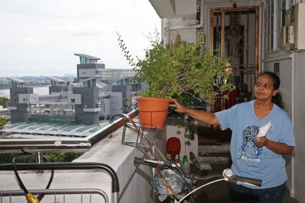 Devi Pushpanathan, 53, outside her flat at Block 213, Marsiling Crescent, on May 26, 2022. — TODAY pic