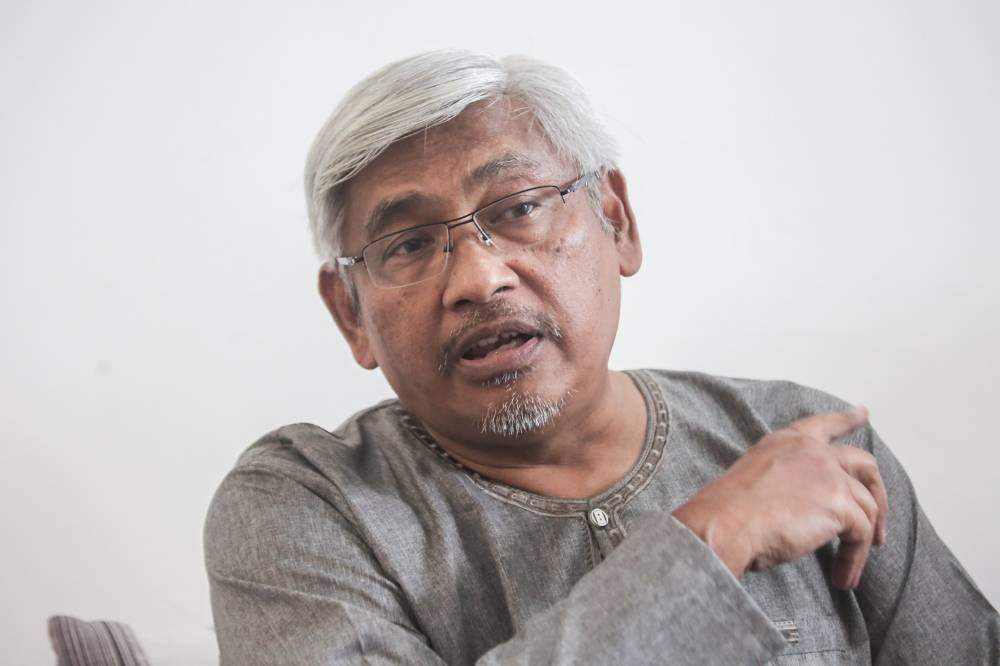 Perak Opposition Leader Abdul Aziz Bari speaks to reporters at his residence in Pengkalan Tiara, Ipoh May 27, 2022. ― Picture by Farhan Najib