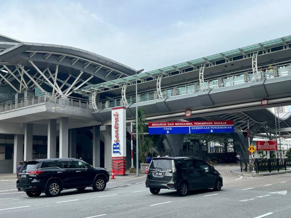 Since the reopening of the land borders on April 1, Johor Baru’s JB Sentral transport hub which connects passengers directly to the Johor Causeway to Woodlands in Singapore has been busy. — Picture by Ben Tan