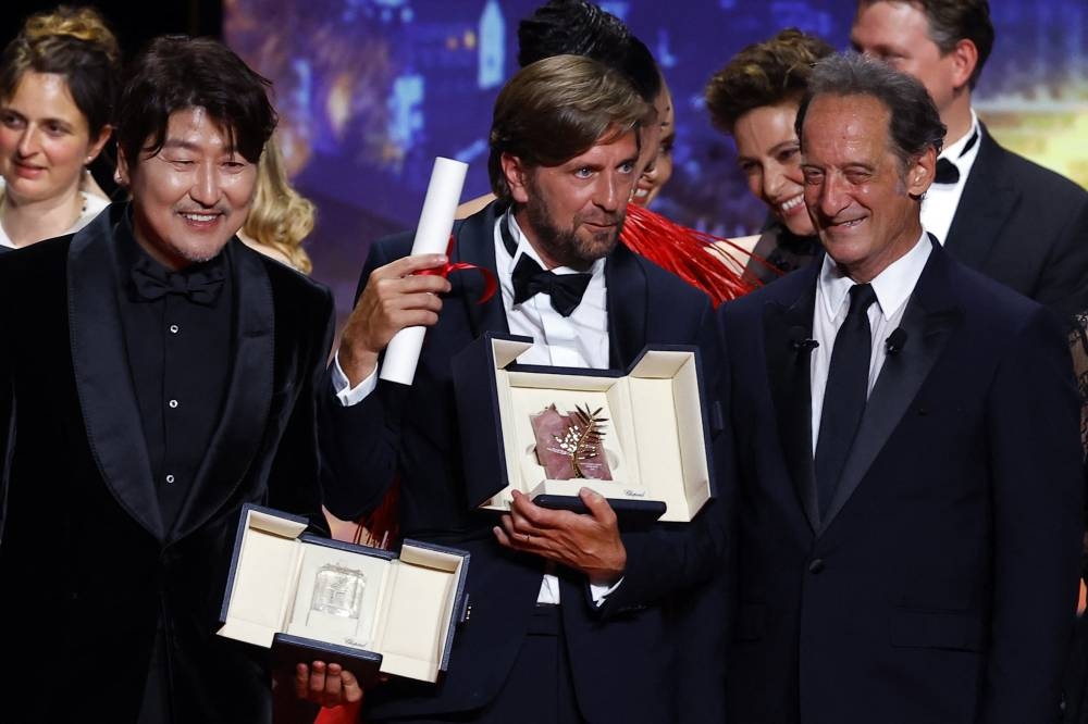 Director Ruben Ostlund (pic), Palme d'Or award winner for the film 'Triangle of Sadness' on stage at the 75th Cannes Film Festival at Cannes May 28, 2022. — Reuters pic