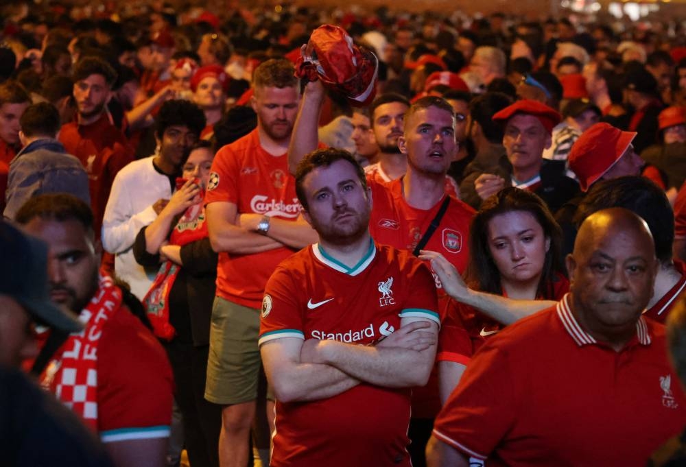 Liverpool fans look dejected as Real Madrid win the Champions League final in Paris May 28, 2022. — Reuters pic