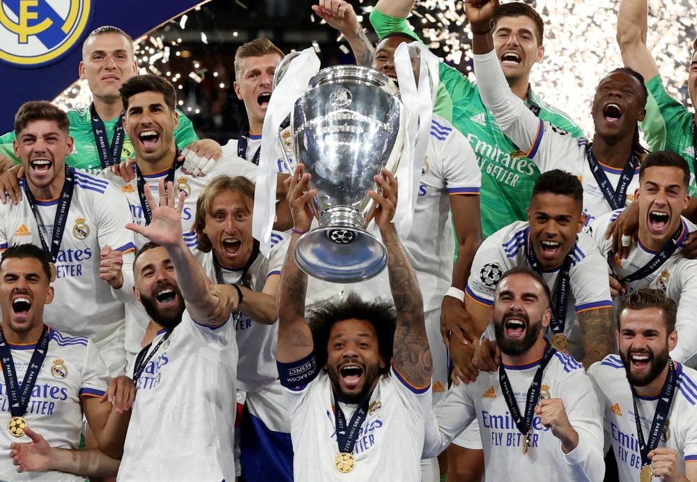 eal Madrid's Marcelo celebrates with the trophy and teammates after winning the Champions League final match against Liverpool in Stade de France, Saint-Denis near Paris May 28, 2022. — Reuters pic