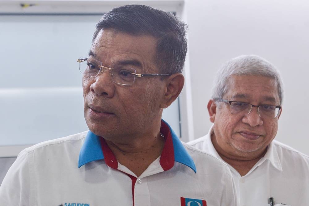 Datuk Seri Saifuddin Nasution speaks during a press conference after a debate with Rafizi Ramli in Shah Alam May 11,2022. — Picture by Miera Zulyana