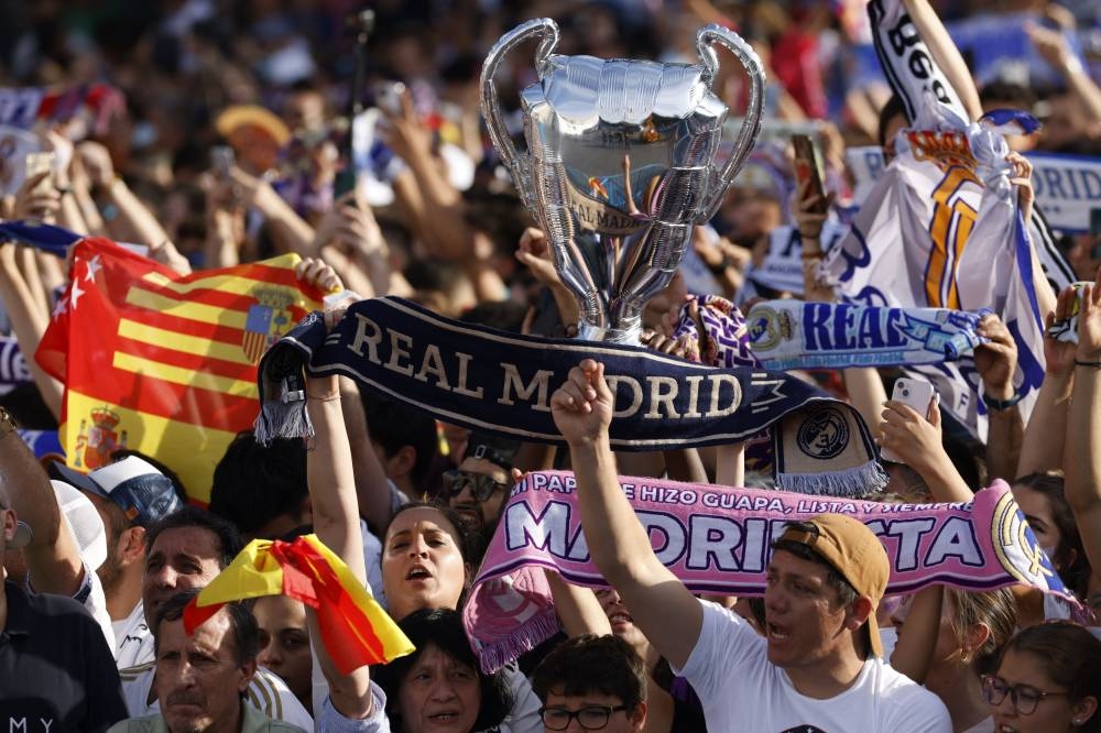 Real Madrid fans are seen ahead of the bus parade in Madrid May 29, 2022. — Reuters pic