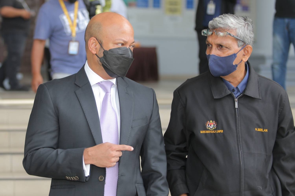 Former 1MDB CEO Arul Kanda Kandasamy (left) is pictured at the Court Complex in Kuala Lumpur on May 30, 2022. — Picture by Devan Manuel