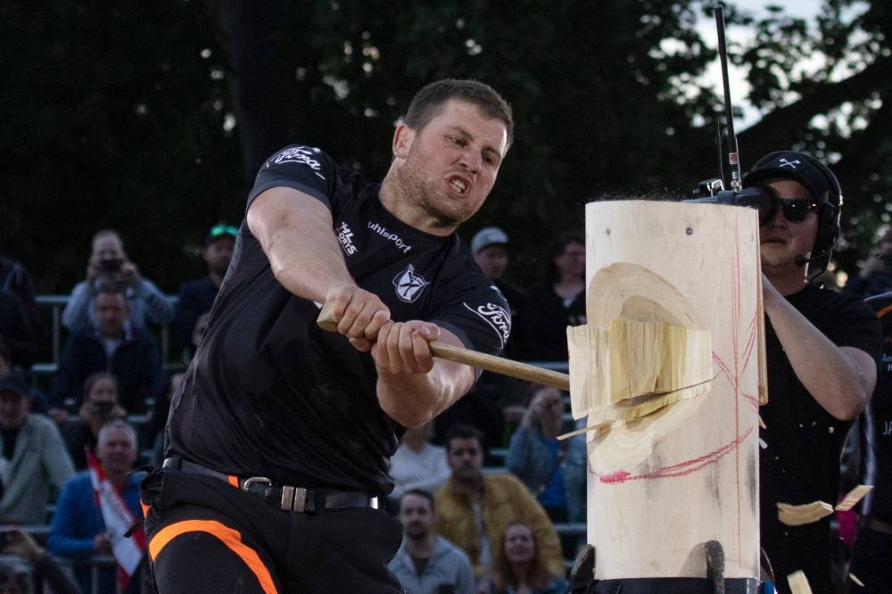 New Zealand's Jack Jordan competes in a wood chopping competition of the Timbersports World Trophy 2022, in Vienna May 28, 2022. — AFP pic
