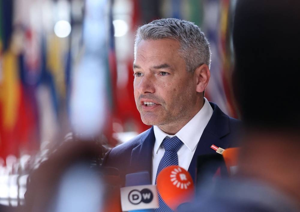 Austrian Chancellor Karl Nehammer speaks to the press ahead of EU leaders extraordinary meeting to discuss Ukraine, defence and energy in Brussels, on May 31, 2022. — AFP pic
