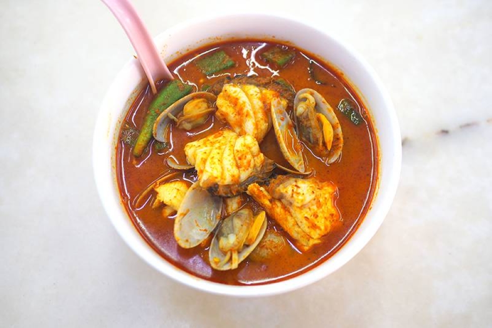 At Pangkor Seafood Hainan Curry Mee, the highlight is that slurp worthy curry with fresh seafood