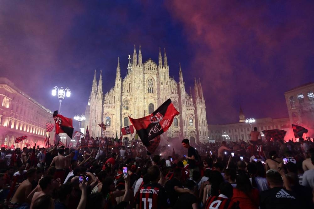 AC Milan fans celebrate at Piazza Duomo in downtown Milan after AC Milan won the 2022 Italian Serie A ‘Scudetto’ championship, May 22, 2022. — AFP pic 