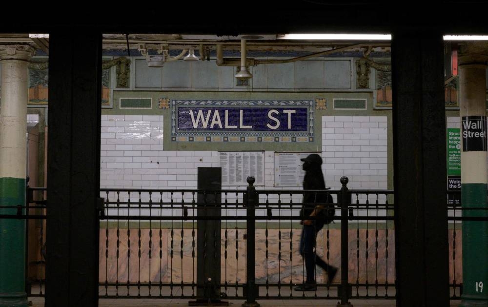 A person walks through the Wall Street subway station near the New York Stock Exchange (NYSE) in New York on May 27, 2022. — AFP pic