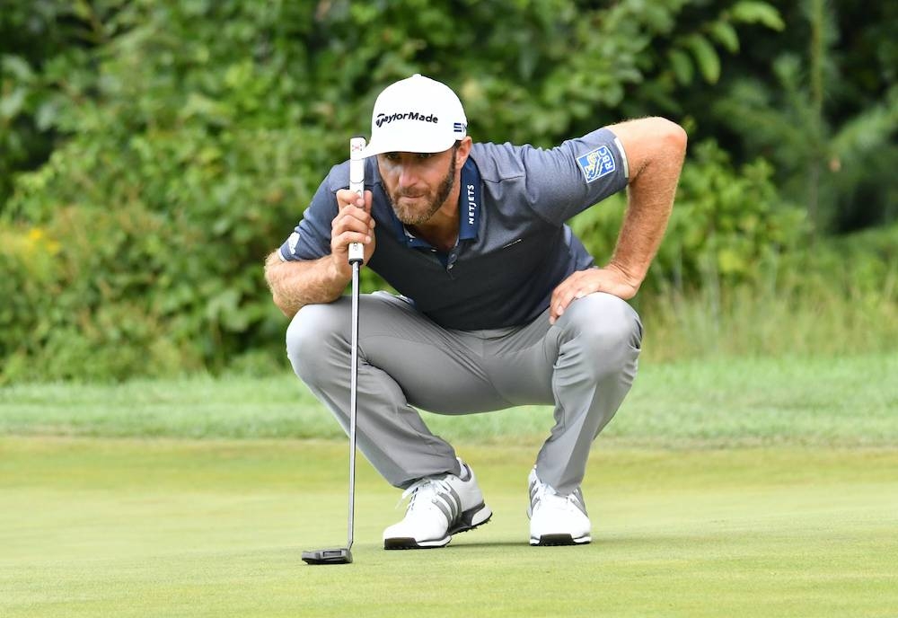 Dustin Johnson lines up a putt on the fifth green during the third round of The Northern Trust golf tournament at TPC of Boston August 22, 2020. — Reuters pic