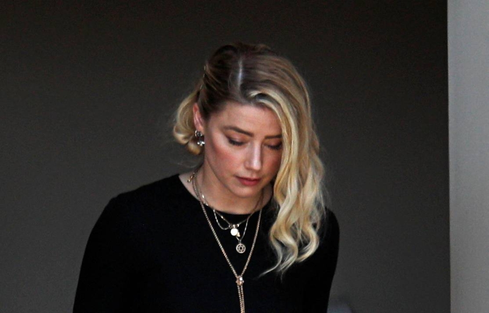 Amber Heard leaves the Fairfax County Circuit Courthouse after the jury announced split verdicts in Virginia June 1, 2022. — Reuters pic