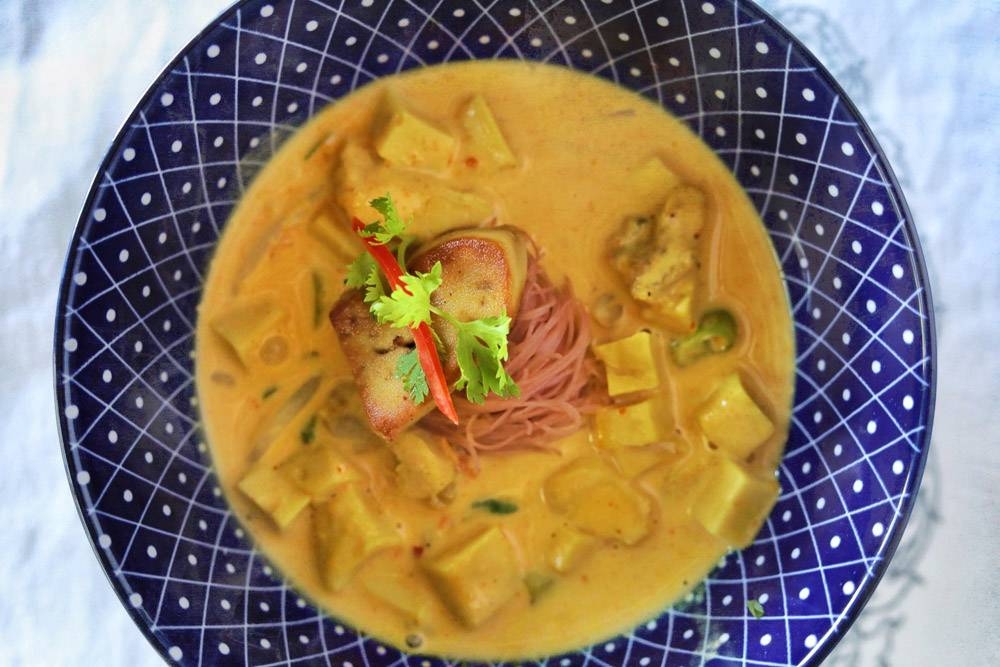 'Kraree mai fhan' is a hearty bowl of curry noodles with simmered free range chicken and foie gras.
