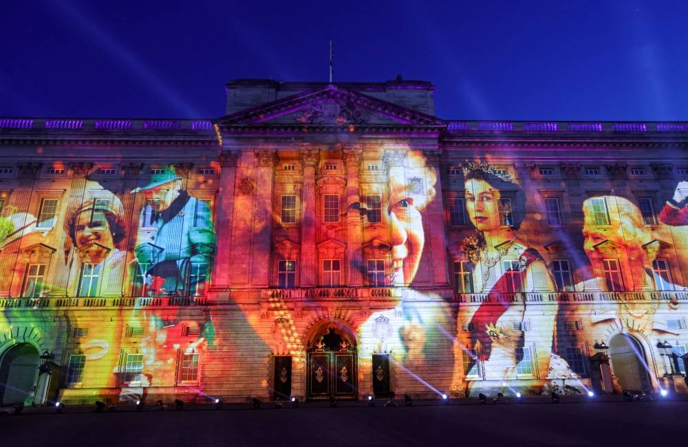 Projections are seen displayed on the front of the Buckingham Palace during the lighting of the principal jubilee beacon, as part of Britain's Queen Elizabeth's Platinum Jubilee celebrations, in London, Britain June 2, 2022. — Chris Jackson/Pool via Reuters