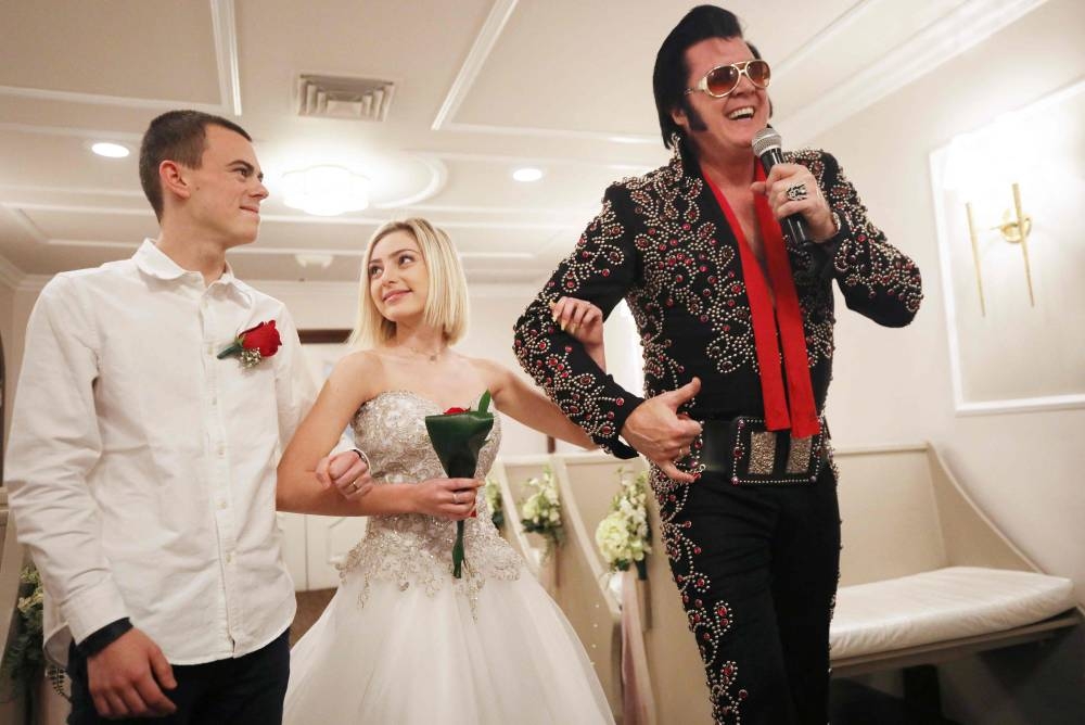 In this file photo taken on February 20, 2020 Elvis impersonator and owner Brendan Paul sings during a 'commitment ceremony' for a couple from France at the Graceland Wedding Chapel in Las Vegas, Nevada. — AFP pic