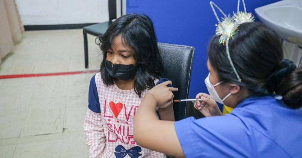 A child gets her Covid-19 jab at the Perak Community Specialist Hospital in Ipoh February 25, 2022. — Picture by Farhan Najib