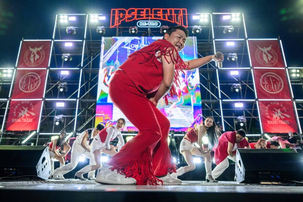 In this picture taken on May 27, 2022, South Korean singer and producer Psy performs his biggest hit song, ‘Gangnam Style’, during a concert at an outdoor venue in the grounds of the Korea University in Seoul. — AFP pic