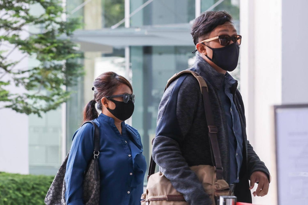 Noorain Jubli (left) and Khairul Annuar Zakaria (right) arriving State Courts on April 21, 2021.  — TODAY pic