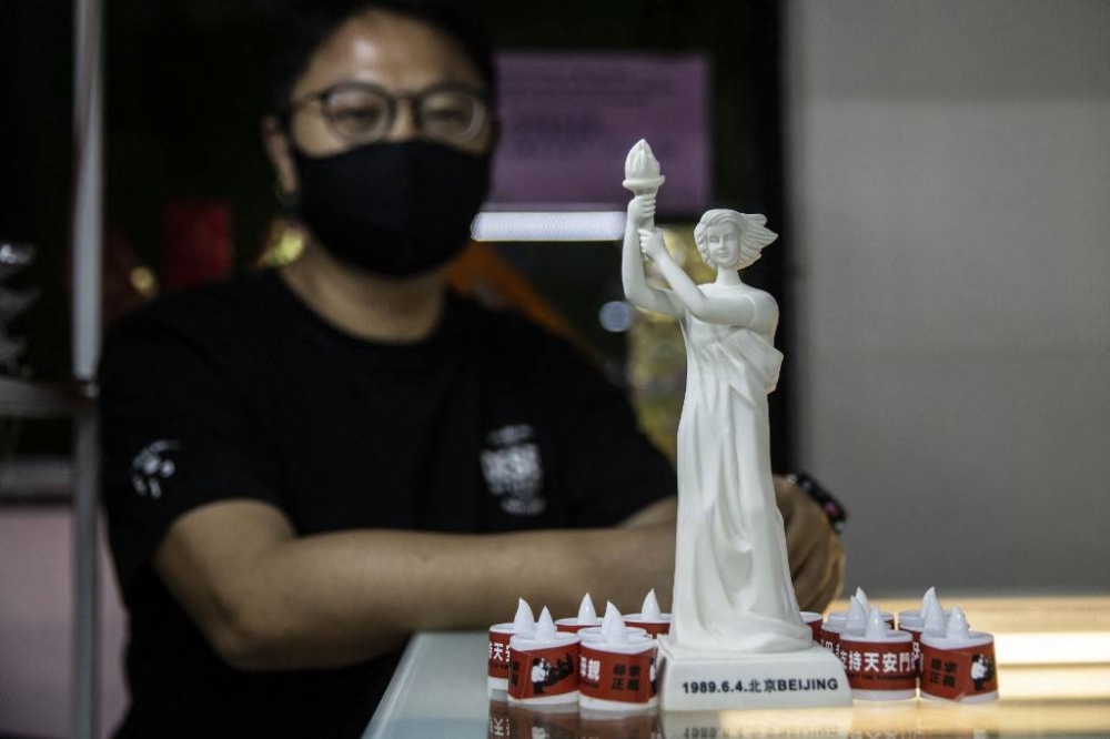 Electric candles and a Goddess of Democracy statue are displayed for sale at a shop in Hong Kong on June 3, 2022, a day before the 33rd anniversary of the 1989 Tiananmen square crackdown. — AFP pic