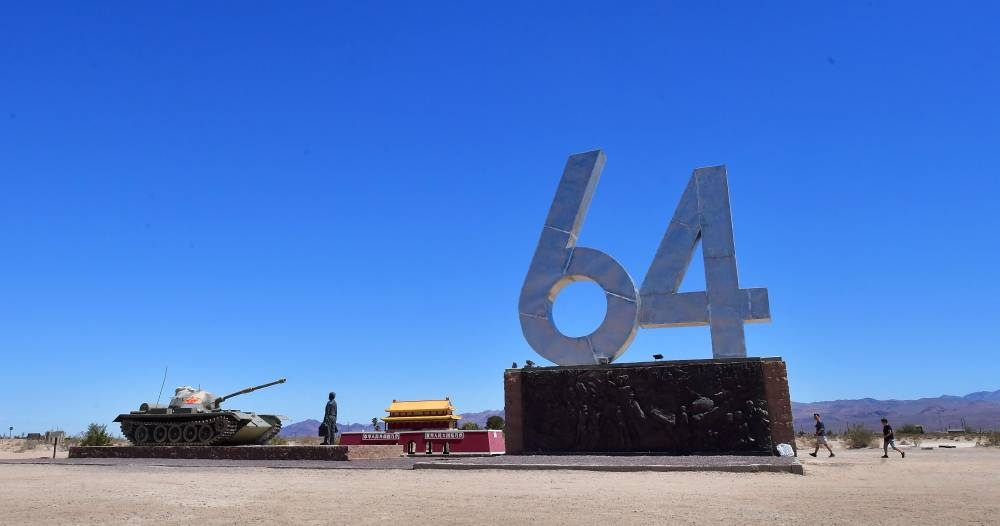 People visit the '6-4' and 'Tank Man' sculptures by artsist Chen Weiming at Liberty Sculpture Park in Yermo, California June 1, 2022. —  AFP pic