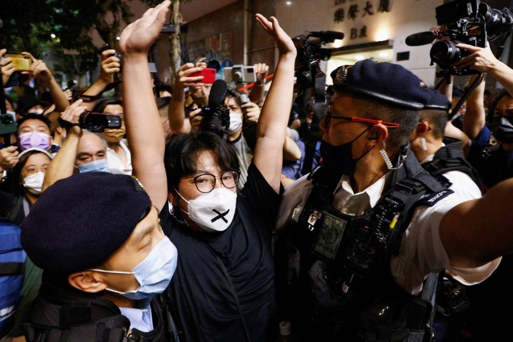 Police officers detain a man outside the closed Victoria Park on the 33rd anniversary of the crackdown on pro-democracy demonstrations at Beijing’s Tiananmen Square in 1989, in Hong Kong, China, June 4, 2022. ― Reuters pic