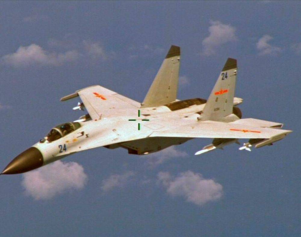 File photo of a Chinese J-11 fighter jet seen flying near a US Navy P-8 Poseidon about 215 km (135 miles) east of China’s Hainan Island in this US Department of Defense handout photo taken August 19, 2014. — Reuters/US Navy/Handout