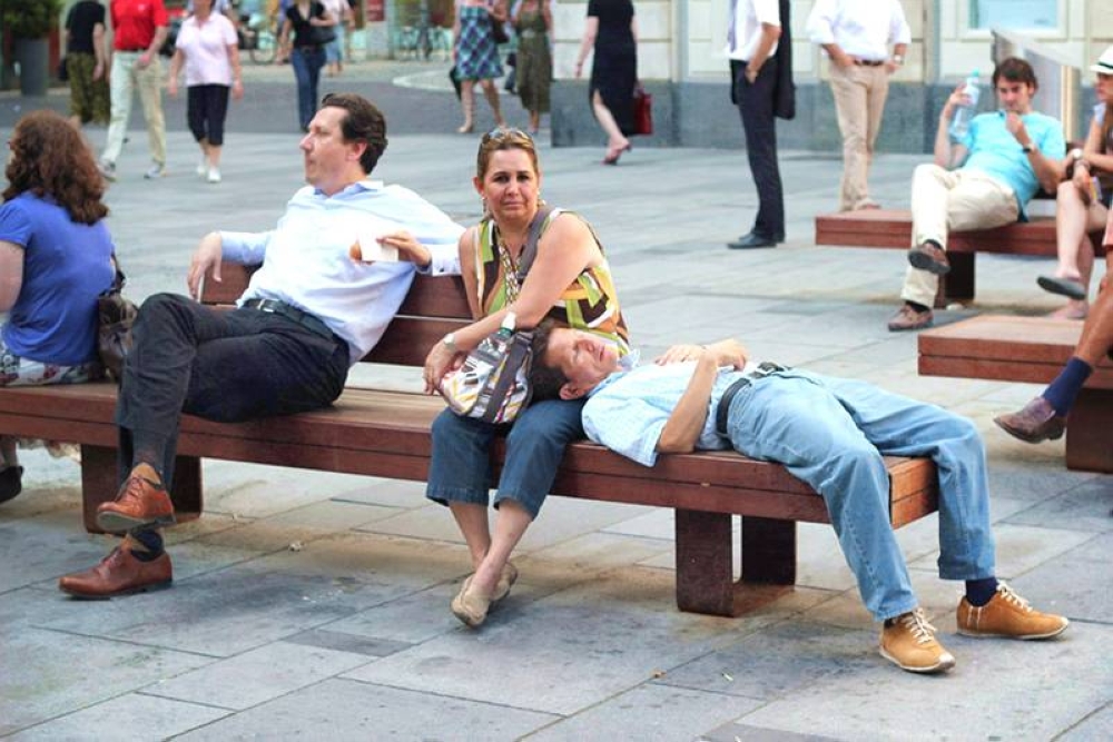 Find the nearest bench, sit down and watch the world go by.