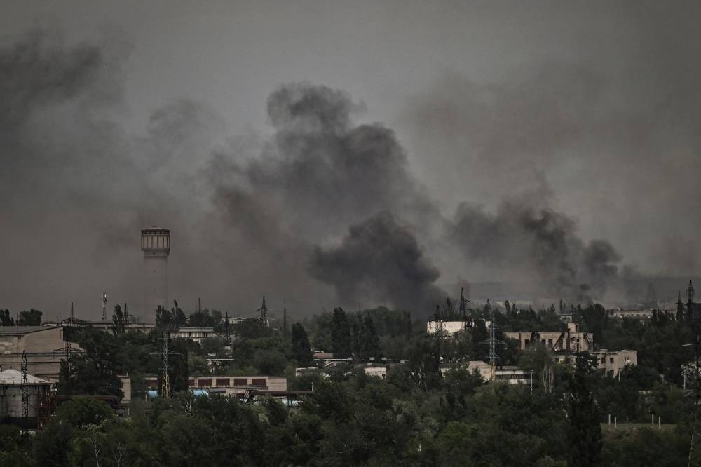 Smoke and dirt rise in the city of Severodonetsk during fighting between Ukrainian and Russian troops at the eastern Ukrainian region of Donbas on June 2, 2022. — AFP pic