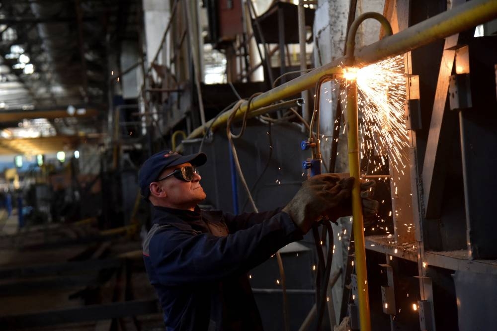 An employee prepares a facility for producing fire trucks, as the factory was relocated from Chernihiv region to Lviv amid Russia's invasion, in Lviv, Ukraine June 5, 2022. — Reuters pic