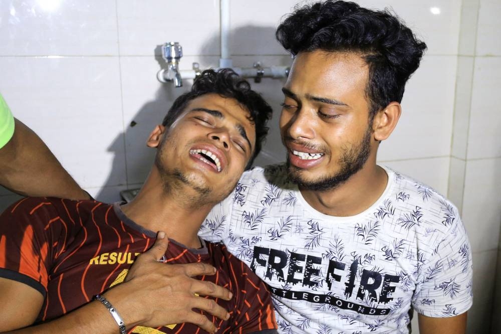 Mourners react after their relatives died in a massive fire which broke out in an inland container depot at Sitakunda, near the port city Chittagong, Bangladesh, June 5, 2022. — Reuters pic