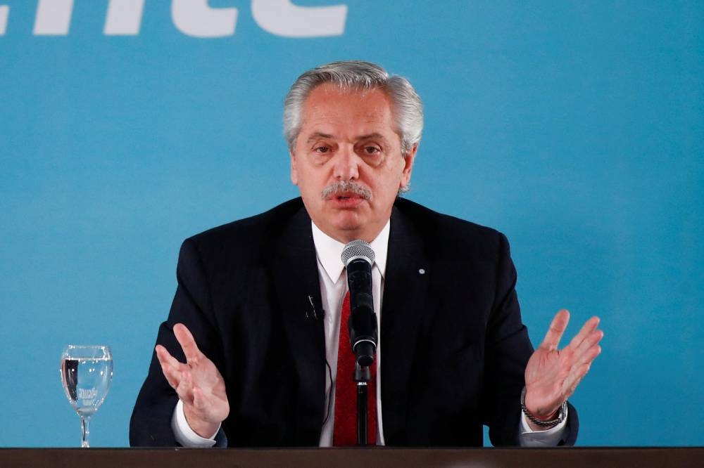 Argentine President Alberto Fernandez speaks as he announces creation of a tax on a so-called 'extraordinary profits' for big companies in Buenos Aires June 6, 2022. — Reuters pic