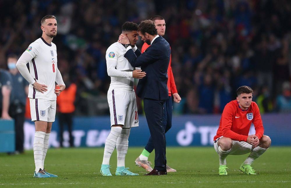 Gareth Southgate consoles Jadon Sancho after England lost the Euro 2020 final to Italy on penalties at Wembley, London July 11, 2021. — Reuters pic