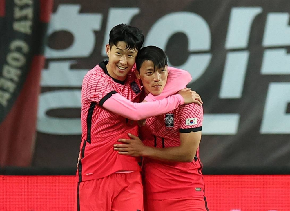 South Korea's Son Heung-min celebrates scoring their second goal against Chile with Hwang Hee-Chan at the Daejeon World Cup Stadium June 6, 2022. — Reuters pic 